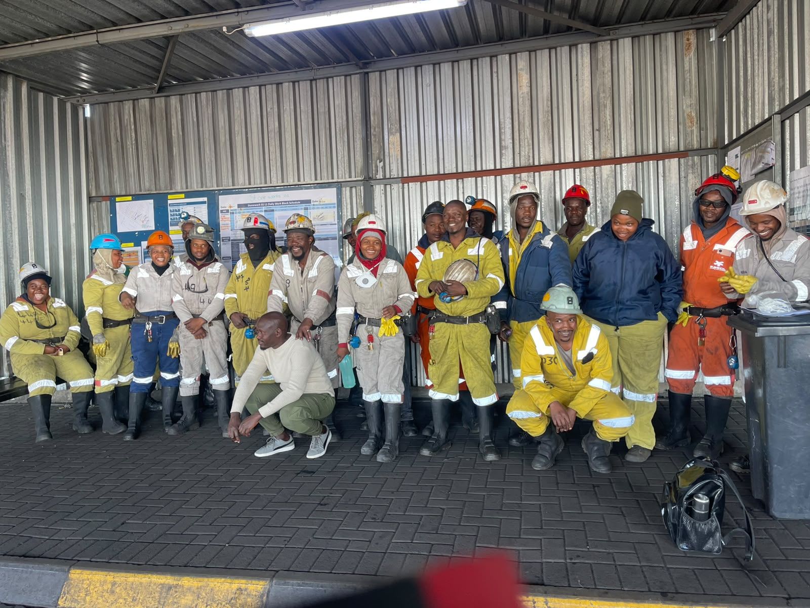 A Peneul Nathi crew lined up in PPE before shift